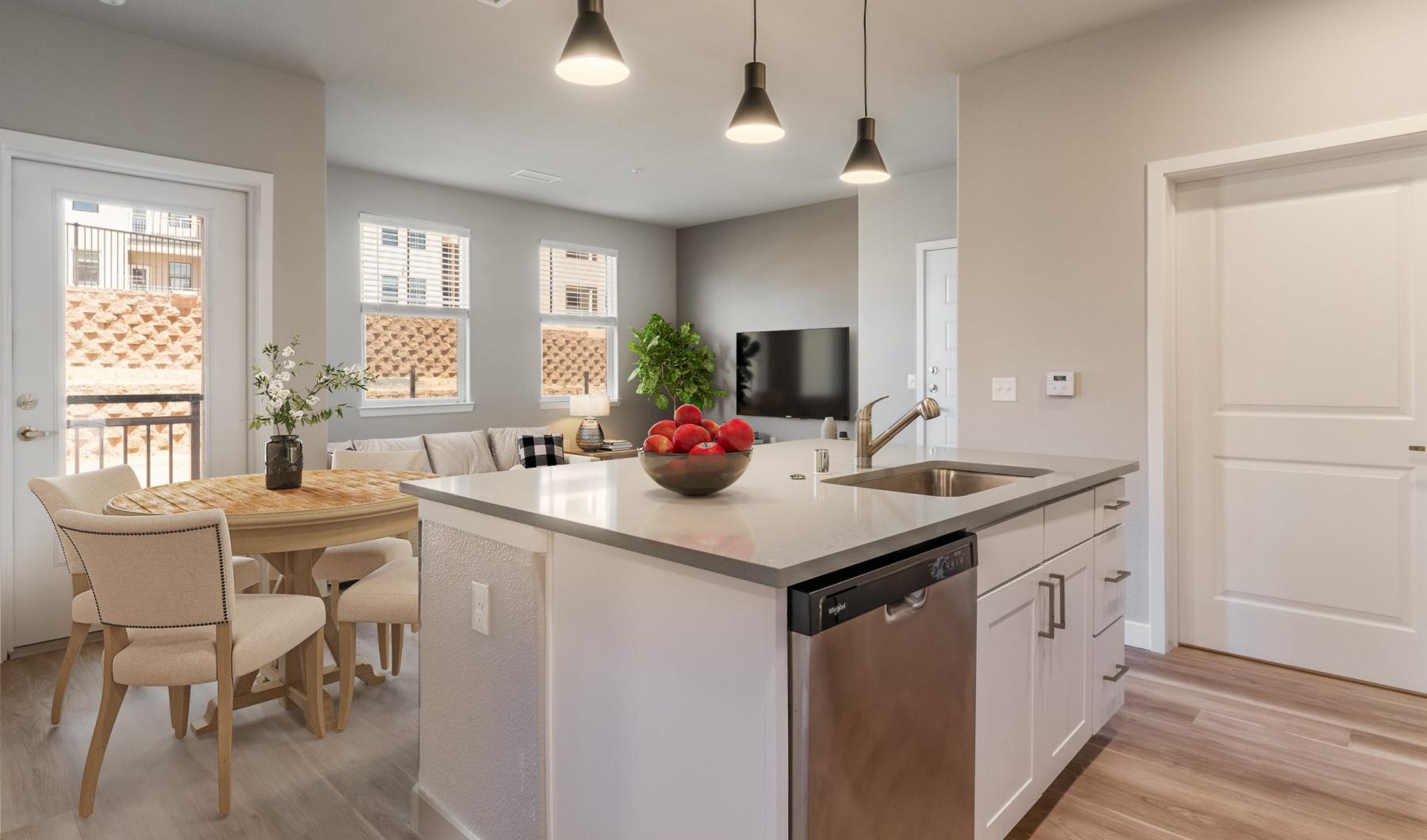 a kitchen with a table and chairs