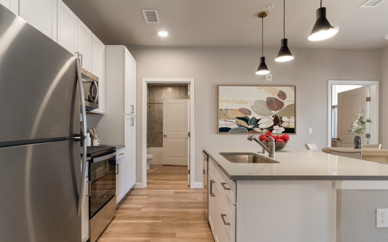 a kitchen with a table and chairs