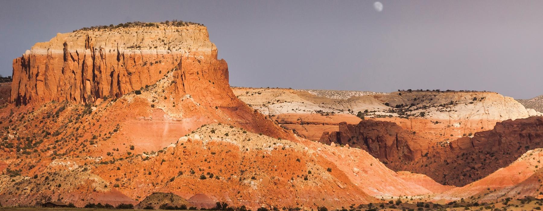 a landscape with a large rock formation