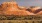a landscape with a large rock formation